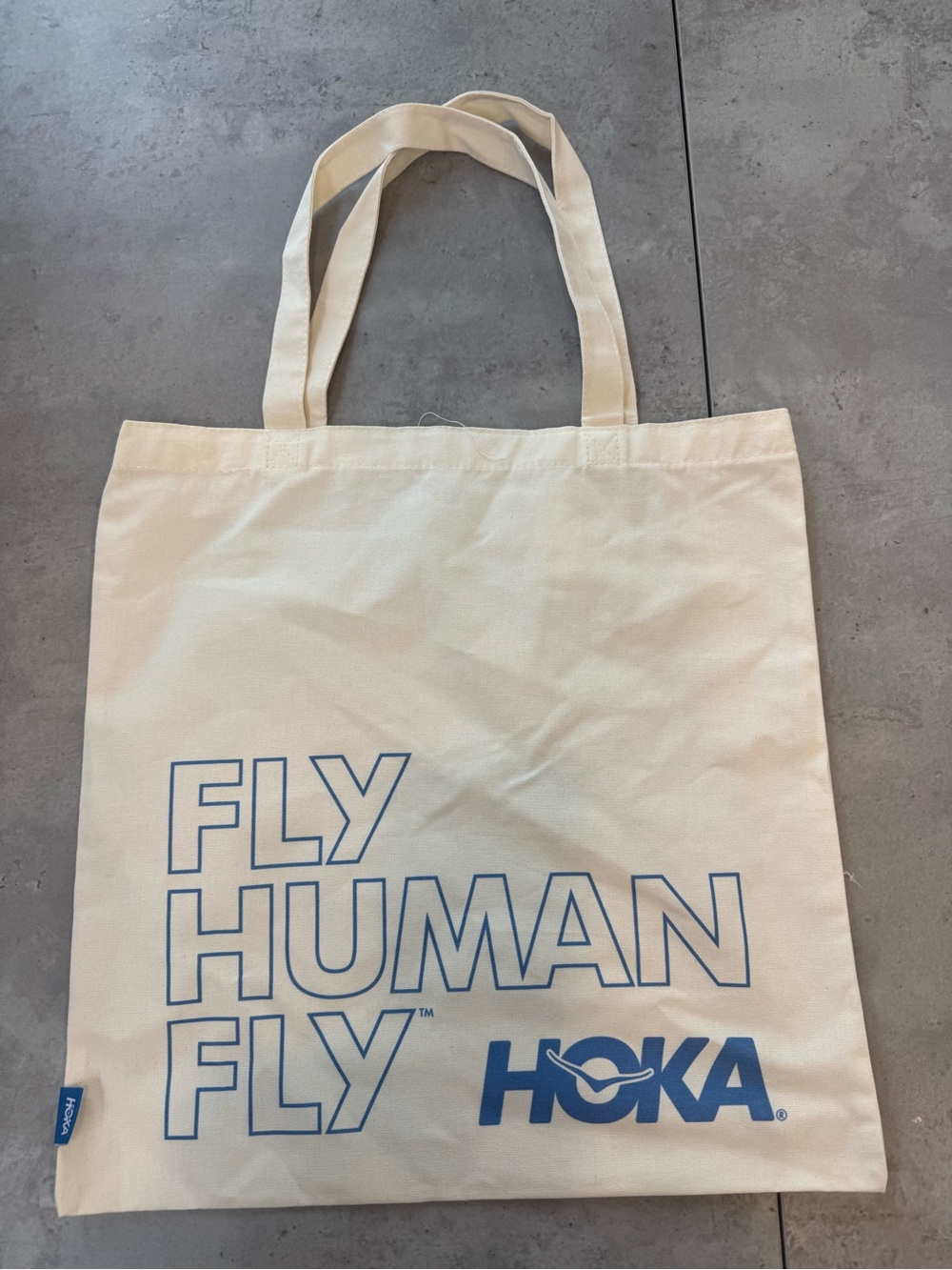 Hoka Cream Canvas Tote with Blue Logo and Slogan